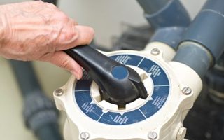Pool pump repair technician at work